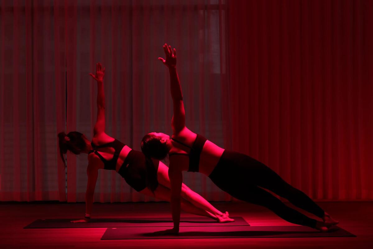 Side plank under infrared light at LŪMA Bangkok